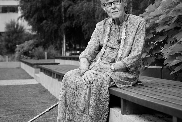 Portrait of Phyllis Manning Creighton sitting in the Peace Garden at Nathan Phillips Square in Toronto.