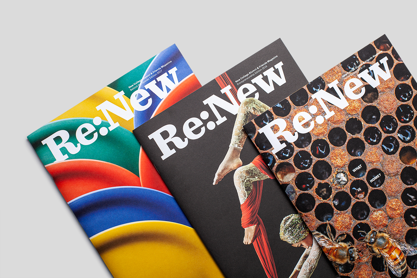 An overlapping stack of three copies of Re:New magazine.